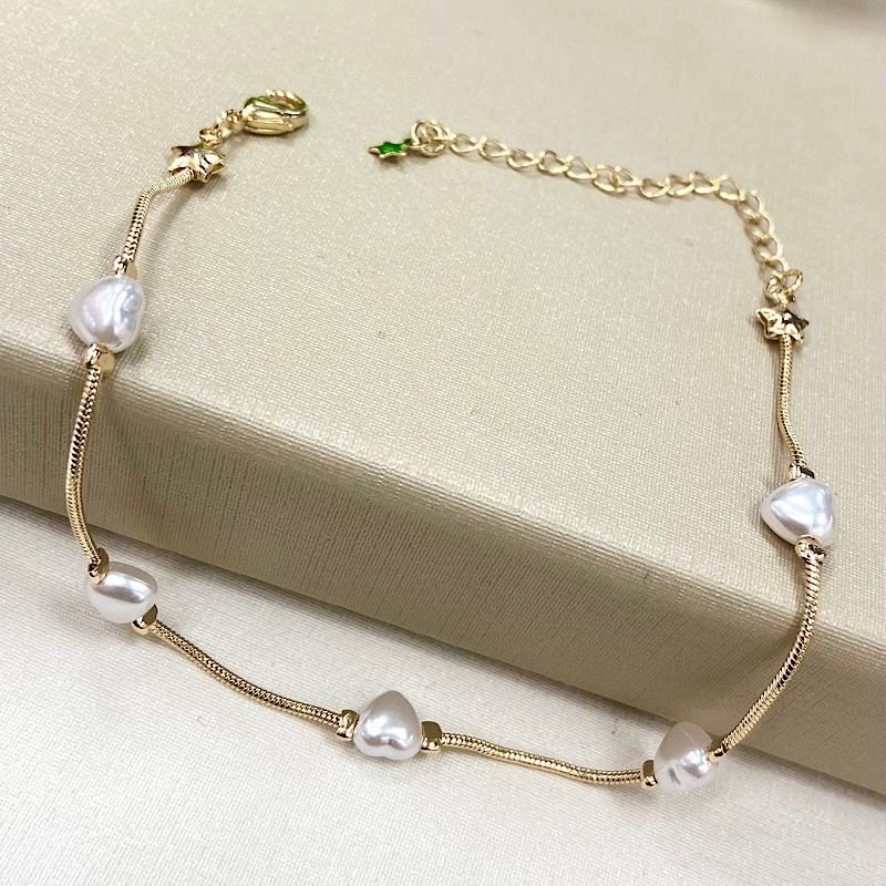 PULSEIRA PEROLA DE CORAÇÃO FOLHEADO A OURO